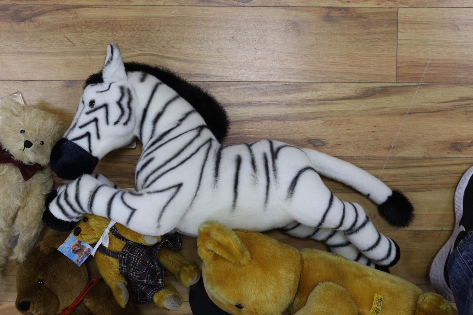 A Deans limited edition teddy Bear, boxed with three other Deans Bears and a large Merrythought Zebra